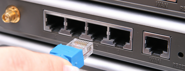 Image of an ethernet cable being plugged in.